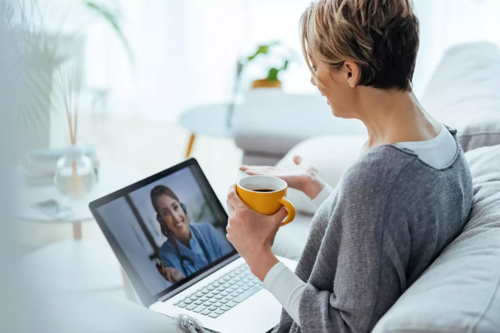 A patient talking with a DUG Health provider during a telehealth visit