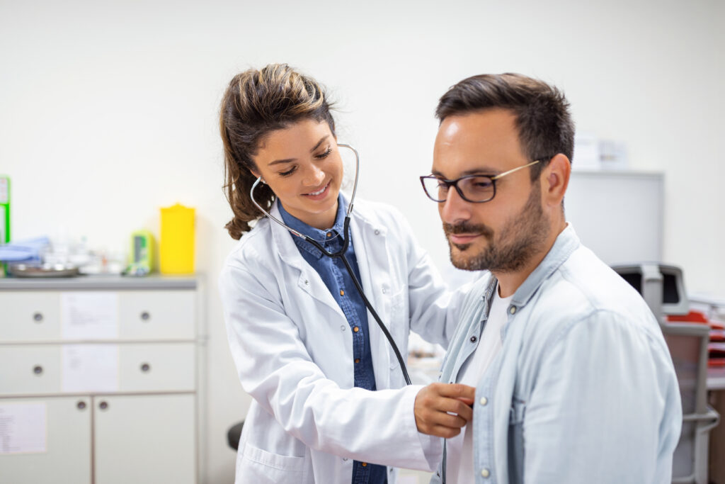 Female Doctor is checking heartbeat of Patient using stethoscope